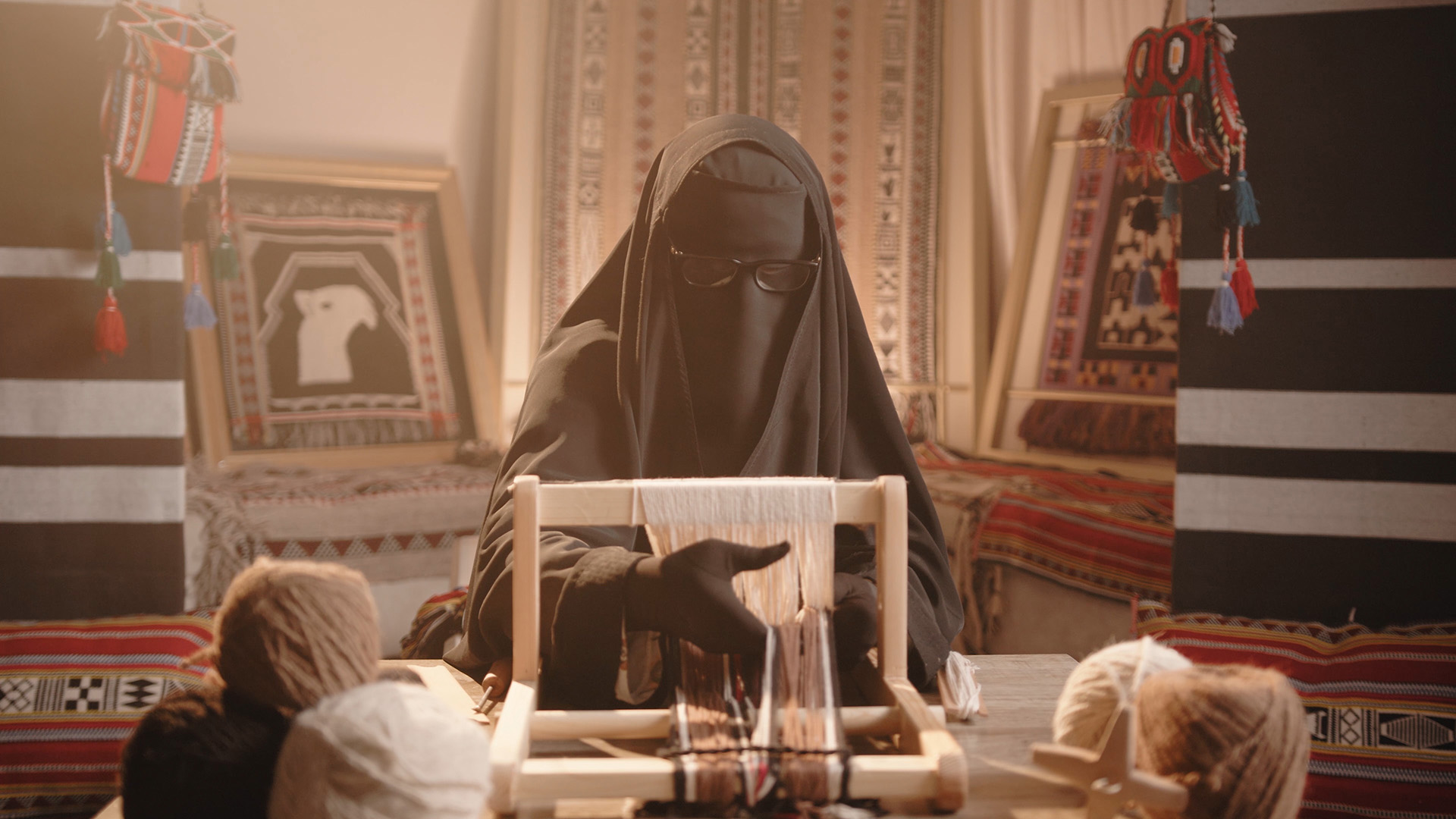 Traditional Saudi Arabia woman working on weaving machine video brand launch